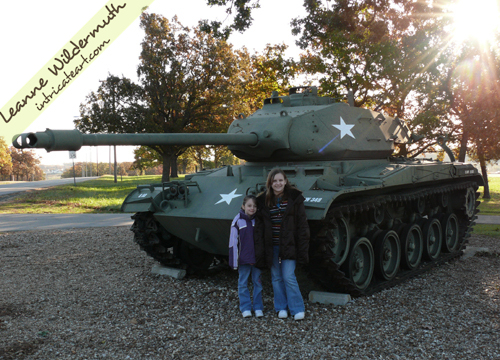girls in front of a tank Fort Leonard Wood Missouri photo Leanne Wildermuth