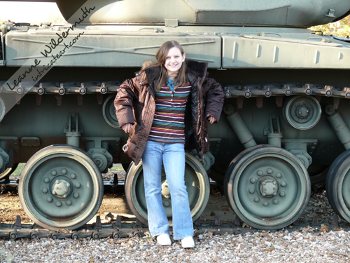 Caitlin in front of a tank Fort Leonard Wood photo Leanne Wildermuth